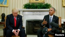 FILE - U.S. President Barack Obama, right, meets with President-elect Donald Trump in the Oval Office of the White House in Washington, Nov. 10, 2016.