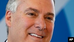 FILE - In this Sept. 25, 2017, file photo Boeing's Kevin McAllister listens during a news conference before a delivery ceremony for a new Boeing 747-8 freighter to Qatar Airways in Everett, Wash.