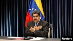 Presiden Venezuela Nicolas Maduro saat berbicara di hadapan media dalam konferensi pers di Istana Miraflores di Caracas, Venezuela, 18 September 2018.