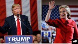 FILE - Republican presidential candidate Donald Trump (L) and Democratic presidential candidate Hillary Clinton are seen acknowledging supporters in a Feb. 20, 2016, photo.