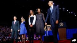 President Barack Obama walks on stage with first lady Michelle Obama, daughter Malia, Vice President Joe Biden and his wife Jill Biden after his farewell address at McCormick Place in Chicago, Jan. 10, 2017. 