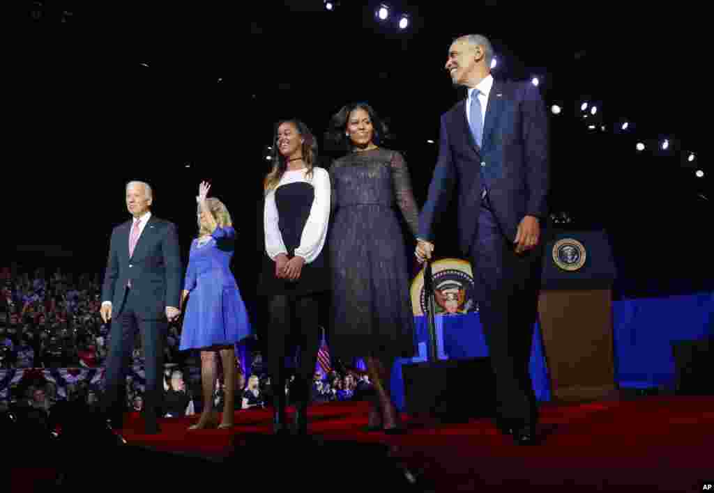 President Barack Obama walks on stage with first lady Michelle Obama, daughter Malia, Vice President Joe Biden and his wife Jill Biden after his farewell address at McCormick Place in Chicago, Jan. 10, 2017. 