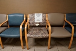 Waiting room chairs are taped off to ensure social distancing at SSM Health St. Anthony Hospital in Shawnee, Oklahoma, April 23, 2020.