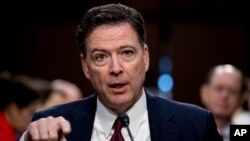 Former FBI director James Comey speaks during a Senate Intelligence Committee hearing on Capitol Hill, June 8, 2017, in Washington. 