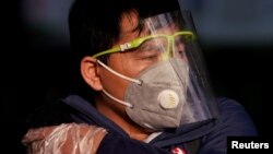 A man wearing a mask is seen at the Shanghai railway station in Shanghai, China, as the country copes with an outbreak of the novel coronavirus, Feb. 12, 2020.
