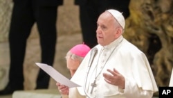 FILE - Pope Francis speaks as he meets participants in the Charis International conference, in the Paul VI hall at the Vatican, June 8, 2019.