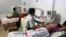 Indian gynaecologists conduct ultrasound examinations on pregnant women at a government-run hospital, March 17, 2015. A new study from New Zealand, has found that women who lie on their backs late in their pregnancies could be increasing their risk of stillbirth.