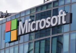 FILE - This April 12, 2016 file photo shows the Microsoft logo in Issy-les-Moulineaux, outside Paris, France.