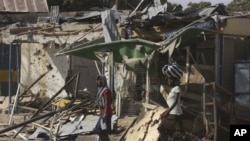 Police say Boko Haram militants staged attack in Kano, Nigeria Jan 24, 2011 which left this market in ruins and left at lead 185 people dead