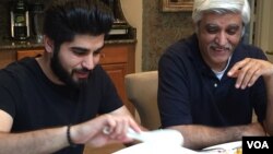 Danish Bashir eats dinner with his father, Imran, at their home in Springfield, Virginia. (C. Presutti/VOA)