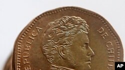 FILE - A Chilean 50-peso coin.