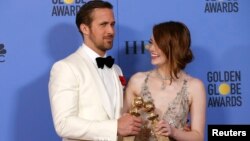 Ryan Gosling and Emma Stone pose with their awards for Best Performance by an Actor in a Motion Picture - Musical or Comedy and Best Performance by an Actress in a Motion Picture - Musical or Comedy for their roles in "La La Land".