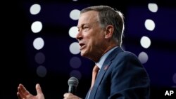 FILE - Former Colorado Gov. John Hickenlooper speaks at the Presidential Gun Sense Forum, Aug. 10, 2019, in Des Moines, Iowa.
