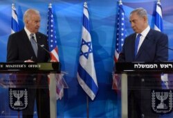 FILE - Then-U.S. Vice President Joe Biden and Israeli Prime Minister Benjamin Netanyahu deliver statements during their meeting in Jerusalem, March 9, 2016.