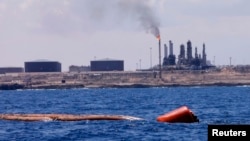FILE - A general view of the port and Zawiya Oil Refinery, west of the city of Tripoli. Libya.