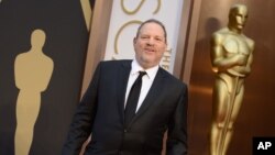 FILE - Harvey Weinstein arrives at the Oscars, March 2, 2014, at the Dolby Theatre in Los Angeles.