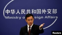 FILE - Chinese Foreign Ministry spokesperson Lin Jian gestures during a news conference in Beijing, March 20, 2024.