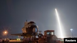 The SpaceX Falcon 9 test rocket lifts off from Space Launch Complex 40 at the Cape Canaveral Air Force Station.