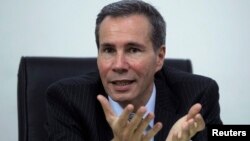 FILE - Argentine prosecutor Alberto Nisman, who is investigating the 1994 car-bomb attack on the Argentine Israelite Mutual Association Jewish community center, is interviewed at his office in Buenos Aires, May 29, 2013. 