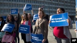 Activists with Planned Parenthood demonstrate in support of a pregnant 17-year-old being held in a Texas facility for unaccompanied immigrant children to obtain an abortion, outside of the Department of Health and Human Services in Washington, Oct. 20, 20