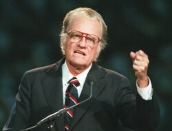 FILE - Evangelist Billy Graham begins his sermon in Atlanta's Georgia Dome, Oct. 26, 1994.