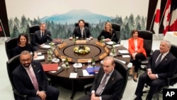 Clockwise from top, Yoshimasa Hayashi, Melanie Joly, Catherine Colonna, Antonio Tajani, Enrique Mora, James Cleverly, Annalena Baerbock and Antony Blinken pose for a photo at the G7 Foreign ministers' meeting in Karuizawa, Japan April 17, 2023. 