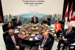 Clockwise from top, Yoshimasa Hayashi, Melanie Joly, Catherine Colonna, Antonio Tajani, Enrique Mora, James Cleverly, Annalena Baerbock and Antony Blinken pose for a photo at the G-7 Foreign ministers' meeting in Karuizawa, Japan, April 17, 2023.