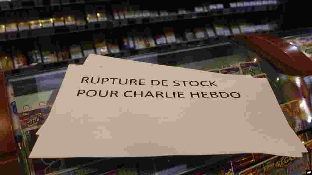 A banner reading: "Stock shortage for Charlie Hebdo" is placed at a newsstand in Lille, northern France, Jan. 14, 2015. 