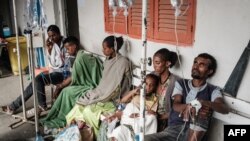 FILE - People who were injured in a deadly airstrike on a market in Togoga wait on a bench for medical treatments at Mekelle General Hospital in Mekelle, June 24, 2021.