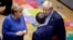 FILE - British Prime Minister Boris Johnson, right, speaks with German Chancellor Angela Merkel, left, and French President Emmanuel Macron during an EU summit in Brussels, Belgium, Oct. 17, 2019.