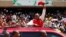 Kenya's President Uhuru Kenyatta waves to supporters as he arrives at the Kasarani stadium for the official launch of the Jubilee Party ahead of the 2017 general elections in Kenya's capital Nairobi, Sept. 10, 2016.