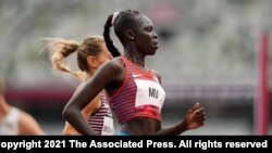 Athing Mu, of United States, wins a heat in the women's 800-meter run at the 2020 Summer Olympics, July 30, 2021, in Tokyo.