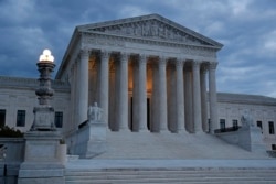 Clouds roll over the Supreme Court at dusk on Capitol Hill in Washington, May 3, 2020.