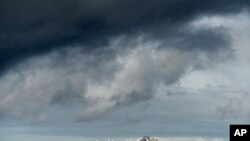 Carrying multiple people who have tested positive for COVID-19, the Grand Princess maintains a holding pattern about 30 miles off the coast of San Francisco, March 8, 2020.