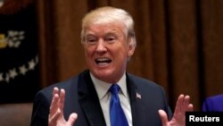 President Donald Trump meets with members of Congress to discuss school and community safety in the wake of the Florida school shootings at the White House in Washington, Feb. 28, 2018. 