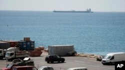 Grace 1 super tanker is anchored near a Royal Marine patrol vessel at the British territory of Gibraltar, July 4, 2019.