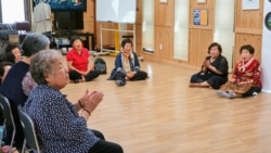 Women whose families were killed, wounded, or arrested during the Gwangju Uprising sing songs at the May Mothers House community center in Gwangju, South Korea. May 20, 2020. (W. Gallo)