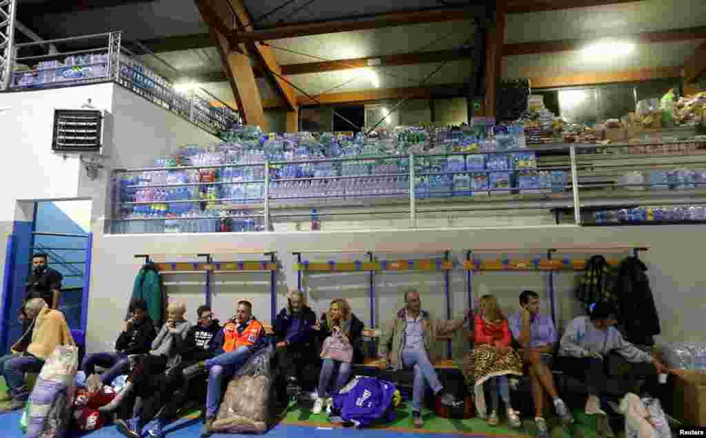 People rest following an earthquake in Amatrice, central Italy, Aug. 24, 2016. 