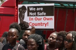 FILE - In November, the Women Doctors Assocation of Malawi held a demonstration against increasing cases of defilement and sexual abuse. Many protesters did not wear face masks. (Lameck Masina/VOA)