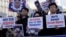 South Korean protesters and North Korean defectors hold portraits of North Korean leader Kim Jong Un during a rally near the U.S. embassy in Seoul, South Korea, urging the United States to discuss North Korean human rights issue in the upcoming Trump-Kim summit, Feb. 26, 2019.