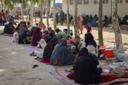 FILE - Afghan internally displaced families are pictured upon their arrival at a refugee camp in Kandahar, July 27, 2021. They fled because of the ongoing battle between Taliban fighters and Afghan security forces,