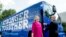 FILE - Democratic presidential candidate Hillary Clinton gets off her campaign bus as she arrives for a rally at K'NEX, a toy company in Hatfield, Pa., July 29, 2016.