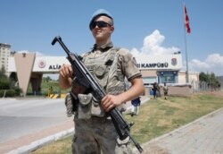 FILE - A Turkish soldier stands guard in front of the Aliaga prison and courthouse complex in Izmir, Turkey, July 18, 2018.