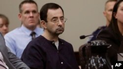 FILE - Larry Nassar sits during his sentencing hearing in Lansing, Michigan, Jan. 24, 2018. 