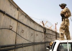 A paratrooper conducts security at Hamid Karzai International Airport in Kabul, Afghanistan, in Kabul, Afghanistan, Aug. 28, 2021, in this image provided by the U.S. Army.