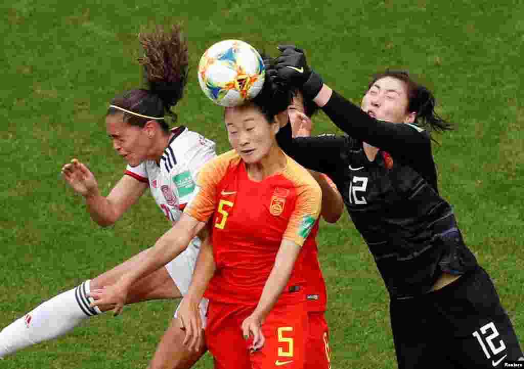 China's Haiyan Wu and Shimeng Peng, and Spain's Andrea Falcon vie for the ball during the 2019 Women's World Cup Group A football match between China and Spain, at the Stade Oceane Stadium in Le Havre, France, June 17, 2019.