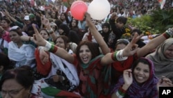 Women supporters of Muttahida Qaumi Movement take part in rally titled 'Empowered Women, Strong Pakistan', Sunday, Feb. 19, 2012 in Karachi, Pakistan.