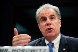 FILE - Department of Justice Inspector General Michael Horowitz testifies on Capitol Hill, June 19, 2018.