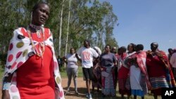 Family and friends gather to mourn Anthony Shungea Pasha who was dismembered and killed by hyenas while he was collecting firewood at a forest neighboring his homestead, in Kajiado, Kenya Feb. 6, 2024.