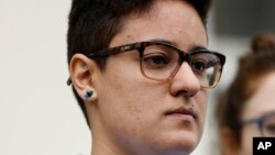 Daniela Vargas, whose father and brother were picked up during a recent immigration raid of undocumented immigrants, listens as speakers discuss the series of raids that also picked up other undocumented immigrants across the state during a news conference in Jackson, Miss., March 1, 2017. Vargas was detained by ICE agents following the news conference.